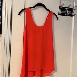 An orange dressy tank top with open back!